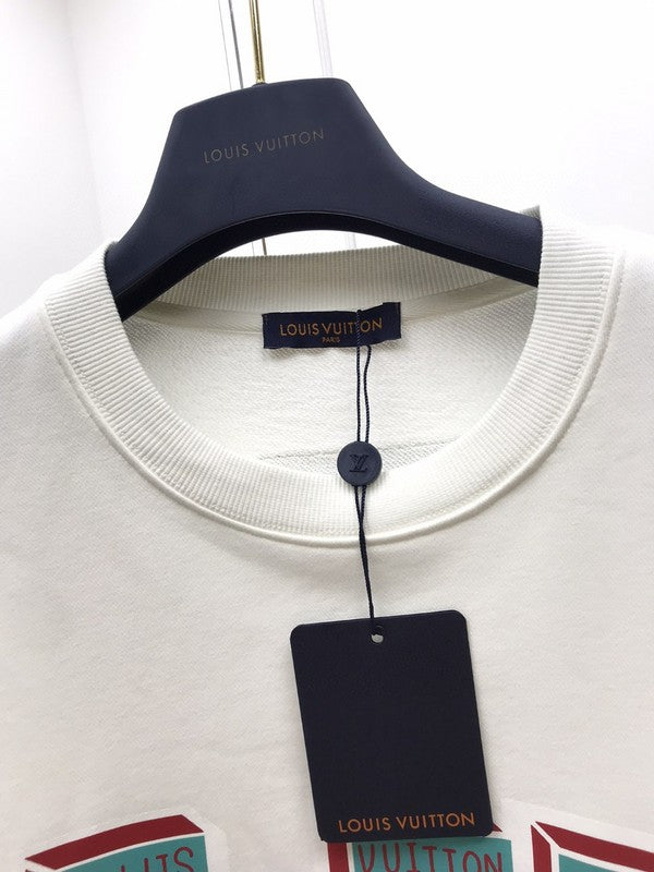 Flat lay presentation of Louis Vuitton luxury clothing with runway-inspired design
