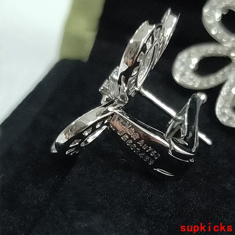Lifestyle view of Van Cleef & Arpels unisex jewelry piece