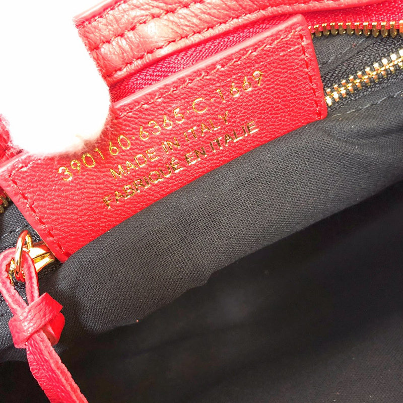Side profile of classic structured women's handbag – women's statement bag