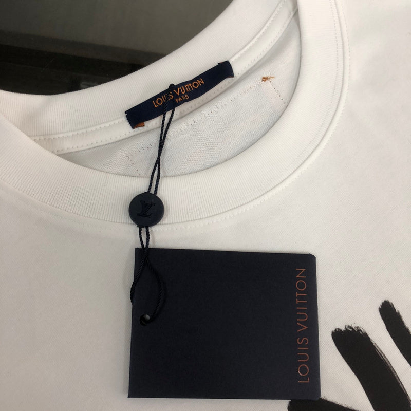 Full styled look of Louis Vuitton cotton t-shirt with label-forward styling