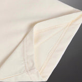 Side profile of Gucci luxury clothing with signature branding