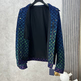 Close-up detail shot of Louis Vuitton luxury clothing with label-forward styling
