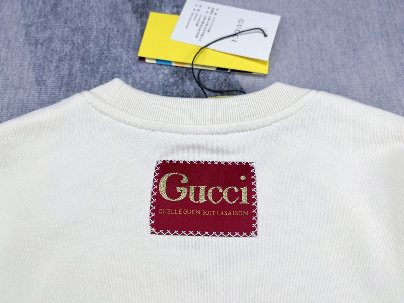 Front view of Gucci luxury clothing with signature branding