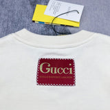 Front view of Gucci luxury clothing with signature branding