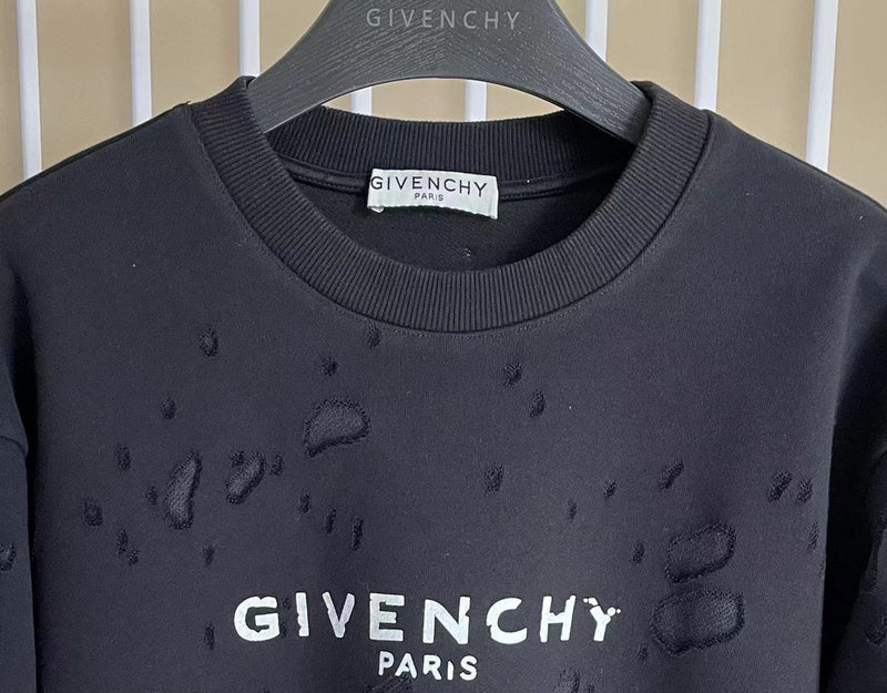 Close-up detail shot of Givenchy luxury clothing with logo-detail design