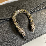 Handle and strap detail of classic premium women's handbag – women's designer-style accessory