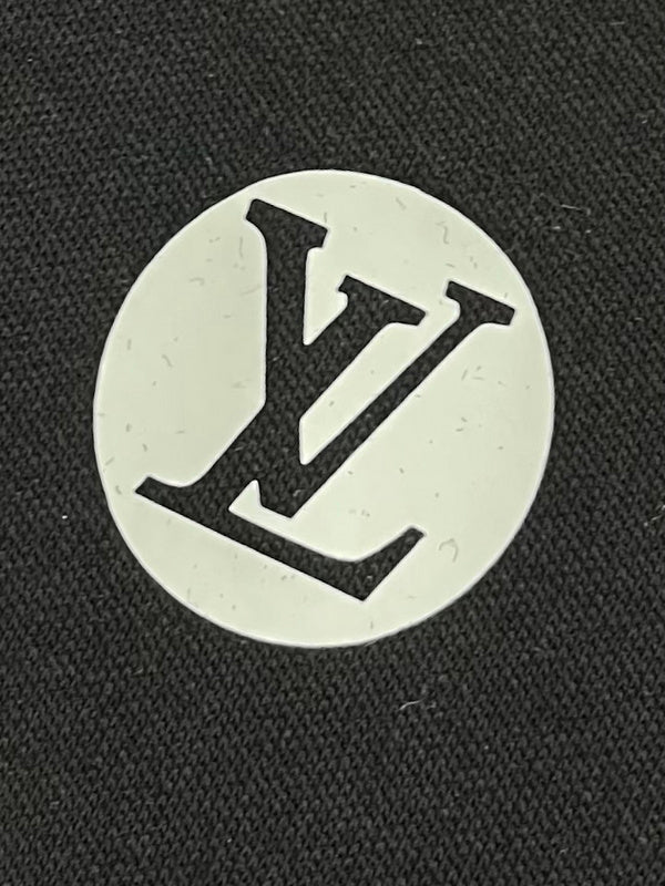 Flat lay presentation of Louis Vuitton luxury clothing with tailored silhouette