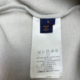 Close-up detail shot of Louis Vuitton luxury clothing with monogram-inspired silhouette