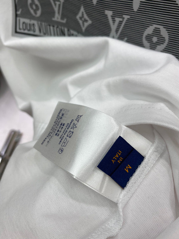 Flat lay presentation of Louis Vuitton cotton t-shirt with runway-inspired design