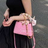  Statement crossbody bag carried on shoulder