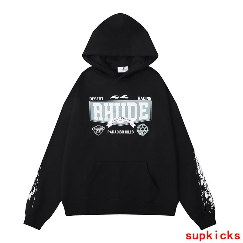 Close-up detail shot of Rhude luxury clothing with signature branding