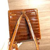Side view of sculpted structured handbag
