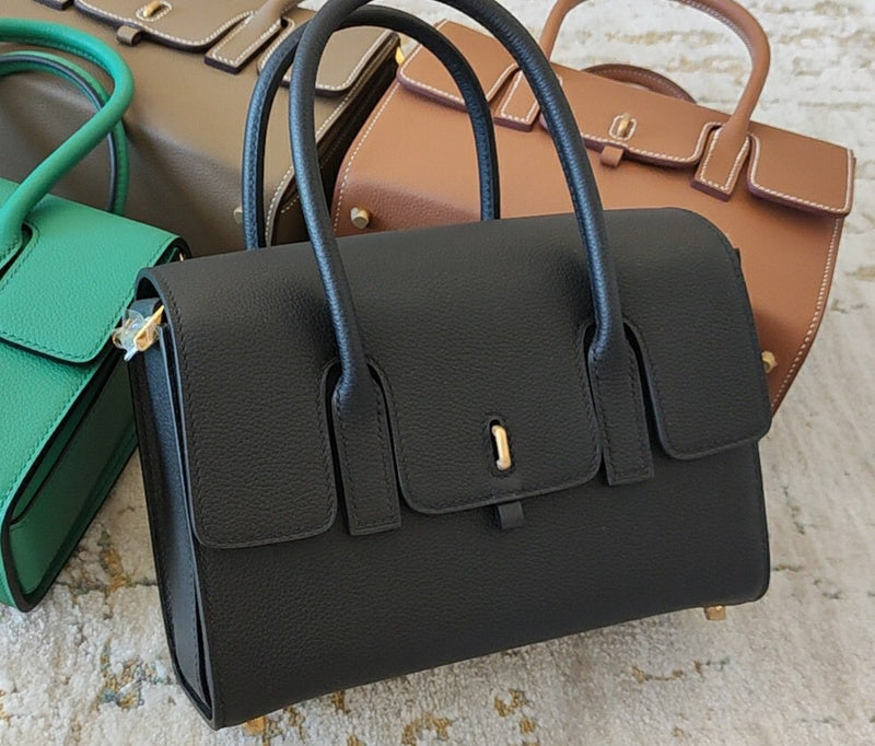 Side view of sculpted structured handbag