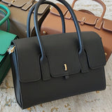 Side view of sculpted structured handbag
