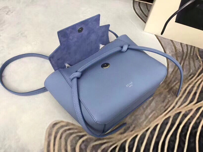 Handle and strap detail of modern structured women's handbag – women's designer-style accessory
