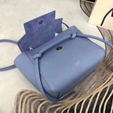 Handle and strap detail of modern structured women's handbag – women's designer-style accessory