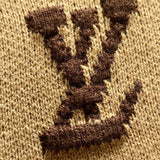 Flat lay presentation of Louis Vuitton luxury clothing with signature branding