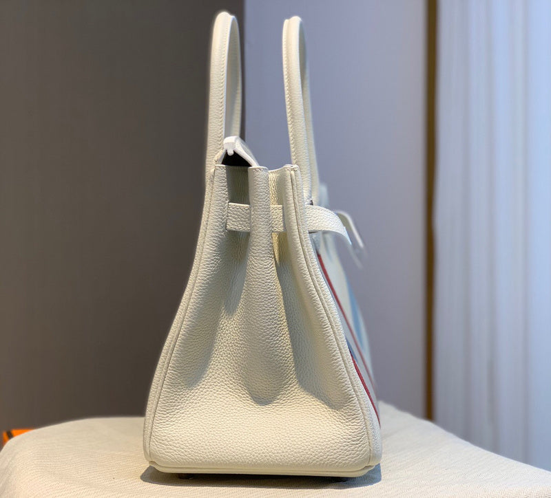 Side view of tailored structured handbag