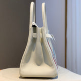 Side view of tailored structured handbag
