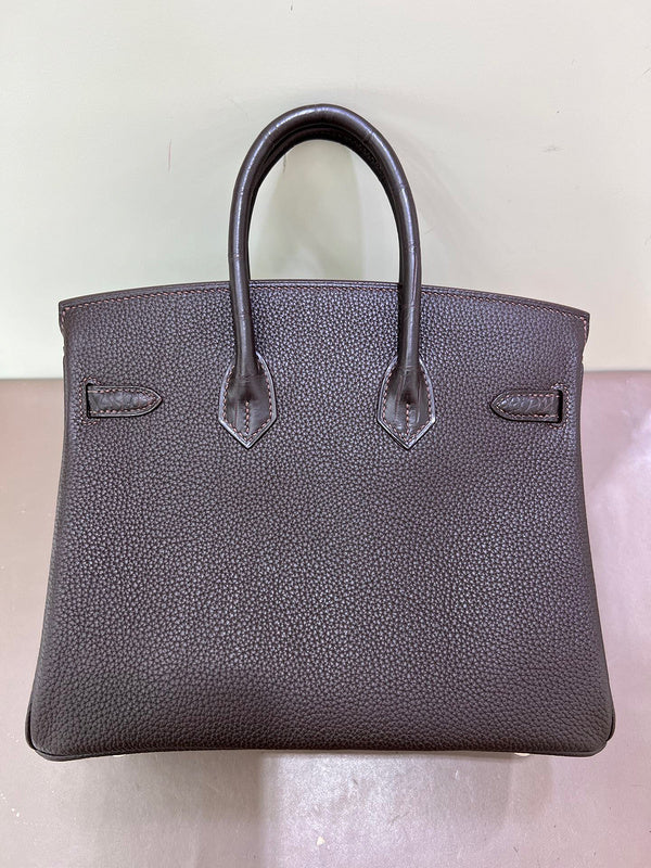 Side view of curated structured handbag