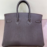 Side view of curated structured handbag