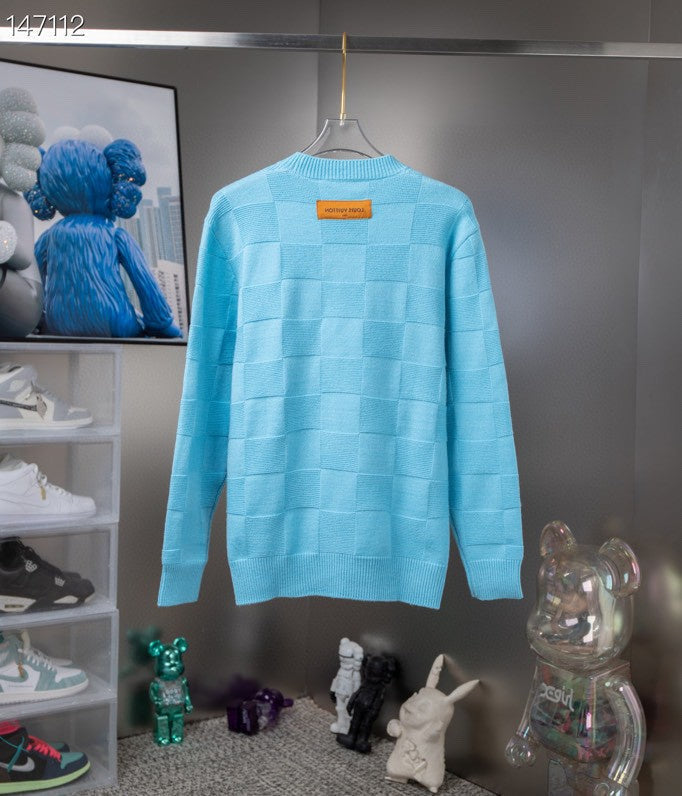 Flat lay presentation of Louis Vuitton luxury clothing with tailored silhouette
