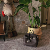Side view of tailored structured handbag