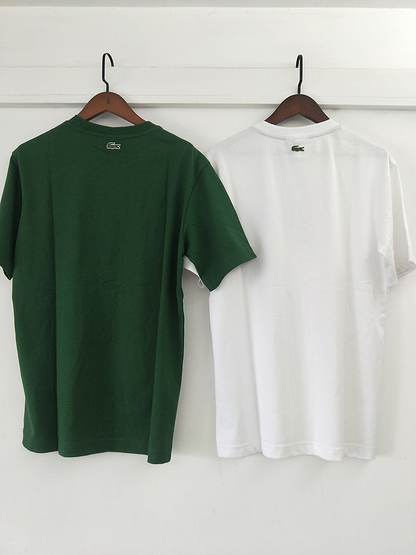 Side profile of Lacoste luxury clothing with signature branding