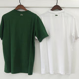 Side profile of Lacoste luxury clothing with signature branding
