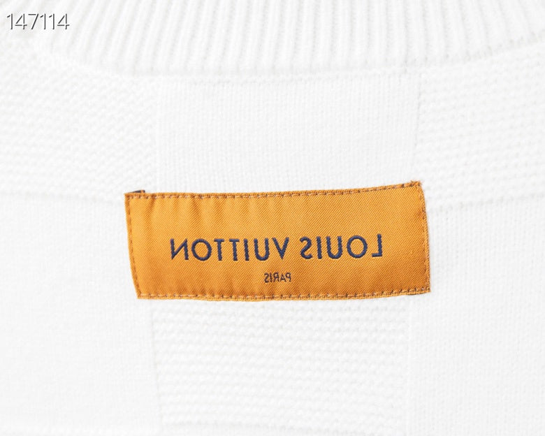 Close-up detail shot of Louis Vuitton luxury clothing with tailored silhouette
