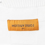 Close-up detail shot of Louis Vuitton luxury clothing with tailored silhouette