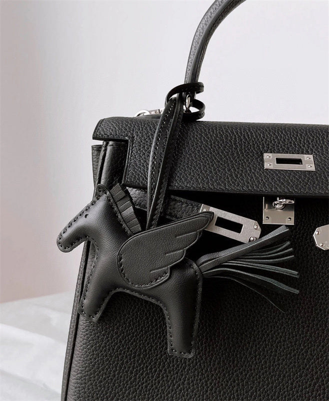  Structured top-handle bag carried on shoulder
