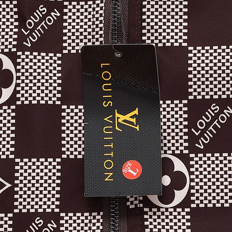Flat lay presentation of Louis Vuitton luxury clothing with logo-detail design