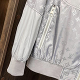 Side profile of Louis Vuitton luxury clothing with label-forward styling