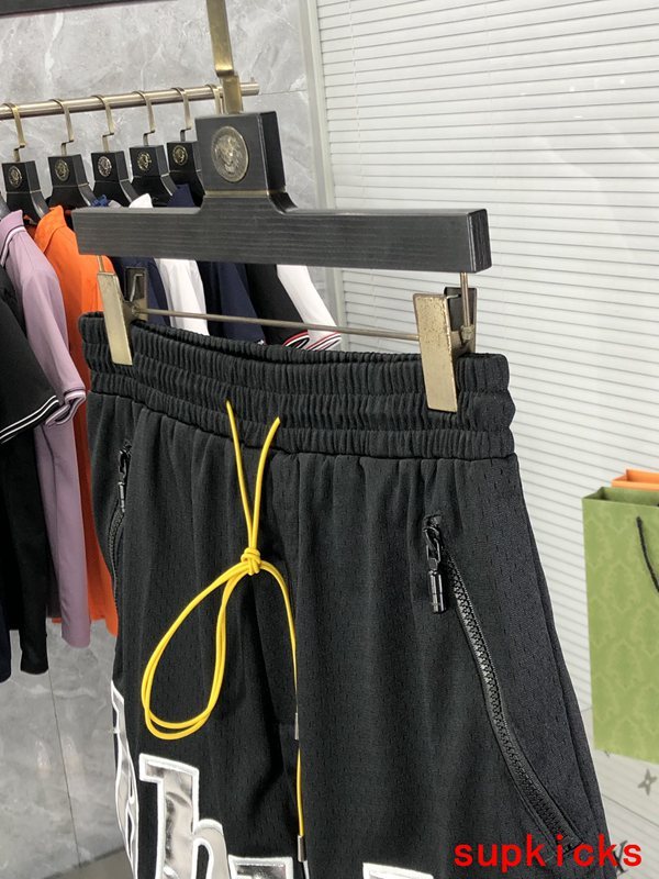 Flat lay presentation of Rhude luxury clothing with contemporary cut