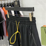 Flat lay presentation of Rhude luxury clothing with contemporary cut