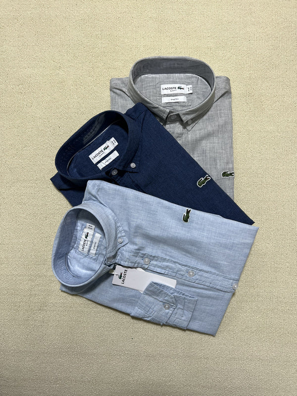 Flat lay presentation of Lacoste luxury clothing with logo-detail design