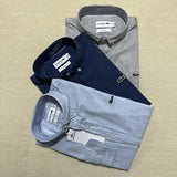 Flat lay presentation of Lacoste luxury clothing with logo-detail design