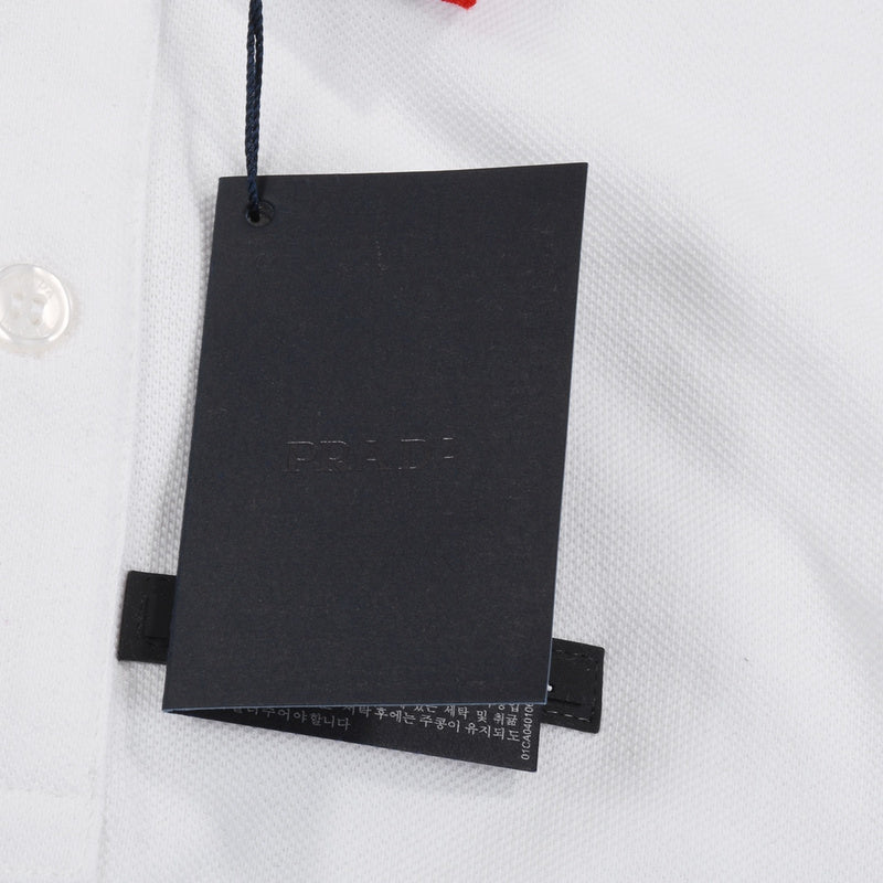 Flat lay presentation of Polo cotton polo shirt with signature branding