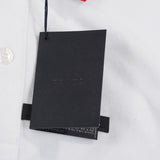 Flat lay presentation of Polo cotton polo shirt with signature branding