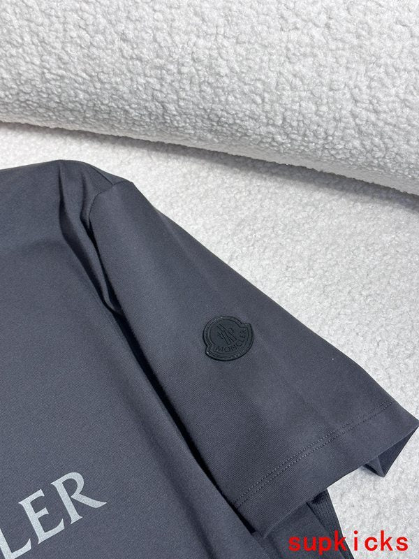 Close-up detail shot of Moncler luxury clothing with signature branding