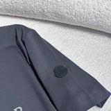 Close-up detail shot of Moncler luxury clothing with signature branding