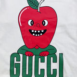 Flat lay presentation of Gucci luxury clothing with signature branding