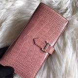 Side view of sleek structured handbag