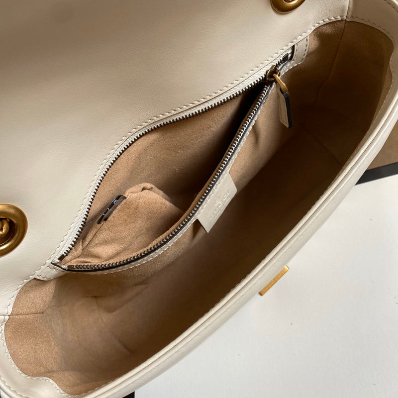 Close-up detail of signature polished women's handbag – women's designer-style accessory