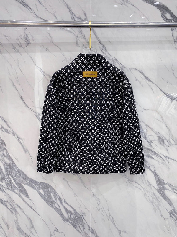 Close-up detail shot of Louis Vuitton luxury clothing with label-forward styling