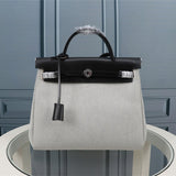Side view of minimalist structured handbag
