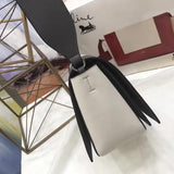 Styled lifestyle shot of modern refined women's handbag – women's luxury accessory