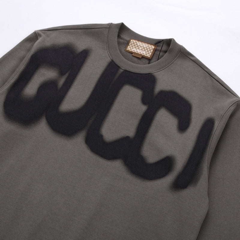 Flat lay presentation of Gucci luxury clothing with tailored silhouette