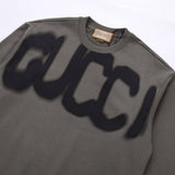 Flat lay presentation of Gucci luxury clothing with tailored silhouette